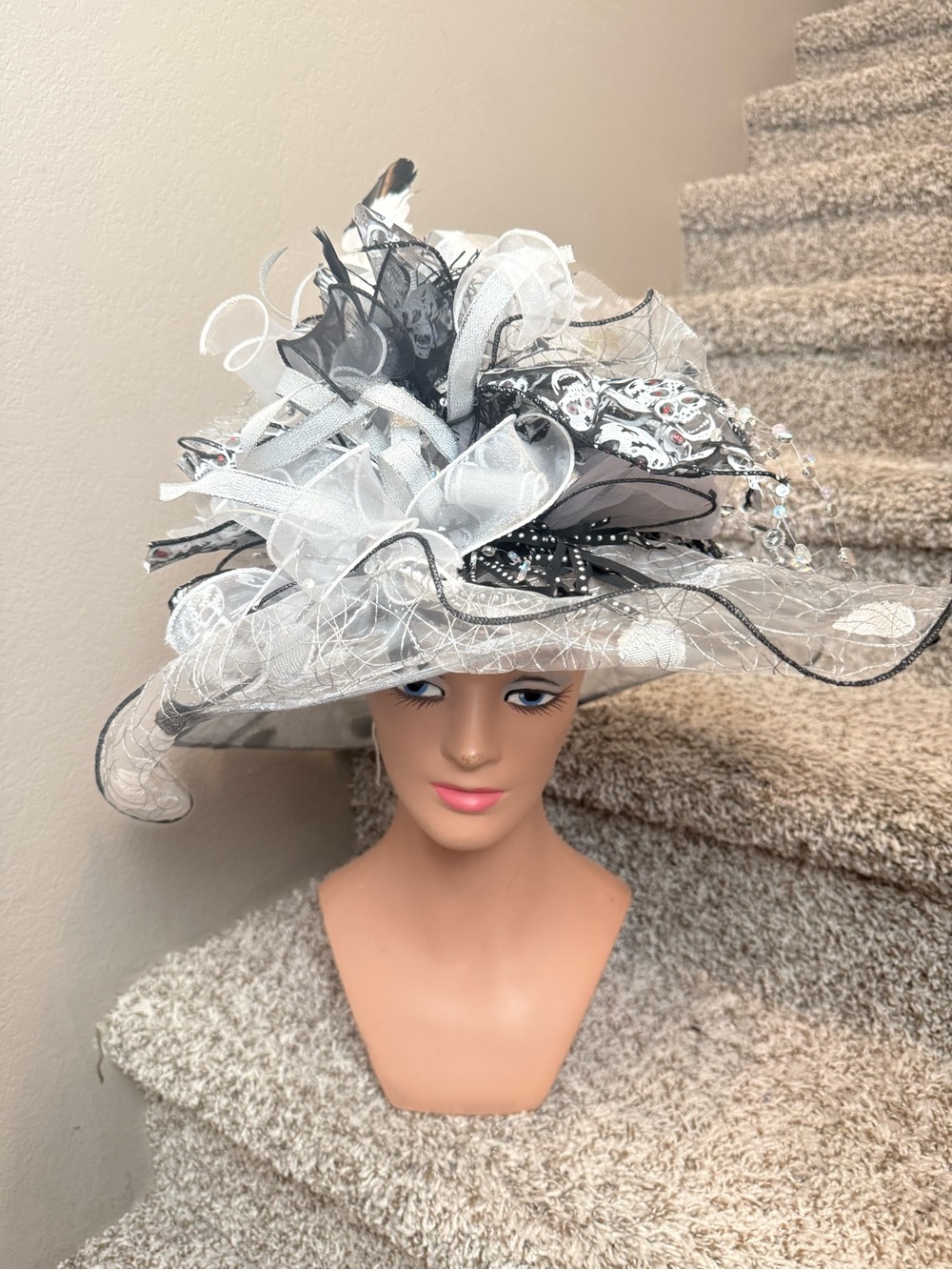 Elegant White and Black Derby Hat with Decorative Feathers and Ribbons fearless